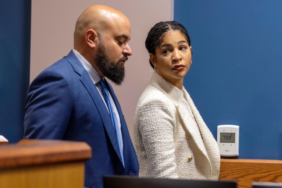 Attorneys Scott Grubman and Serreen Meki, both representing lawyer Kenneth Chesebro, confer in the courtroom of Fulton Superior Court Judge Scott McAfee, Friday, Oct. 20, 2023, at the Fulton County Courthouse in Atlanta, Georgia. Jury selection is set to begin Friday for Chesebro, the first defendant to go to trial in the Georgia case that accuses former President Donald Trump and others of illegally scheming to overturn the 2020 election in the state. (Alyssa Pointer/Pool Photo via AP)