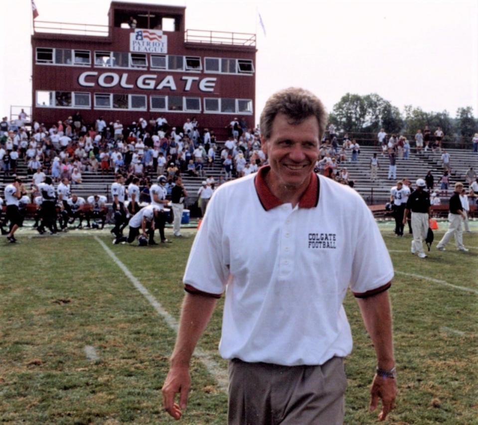 Colgate football coach Dick Biddle walks off the field following one of his school-record 137 victories. Biddle was the head coach at Colgate from 1996 to 2013 and led the 2003 Raiders to the NCAA's Division I-AA championship game.