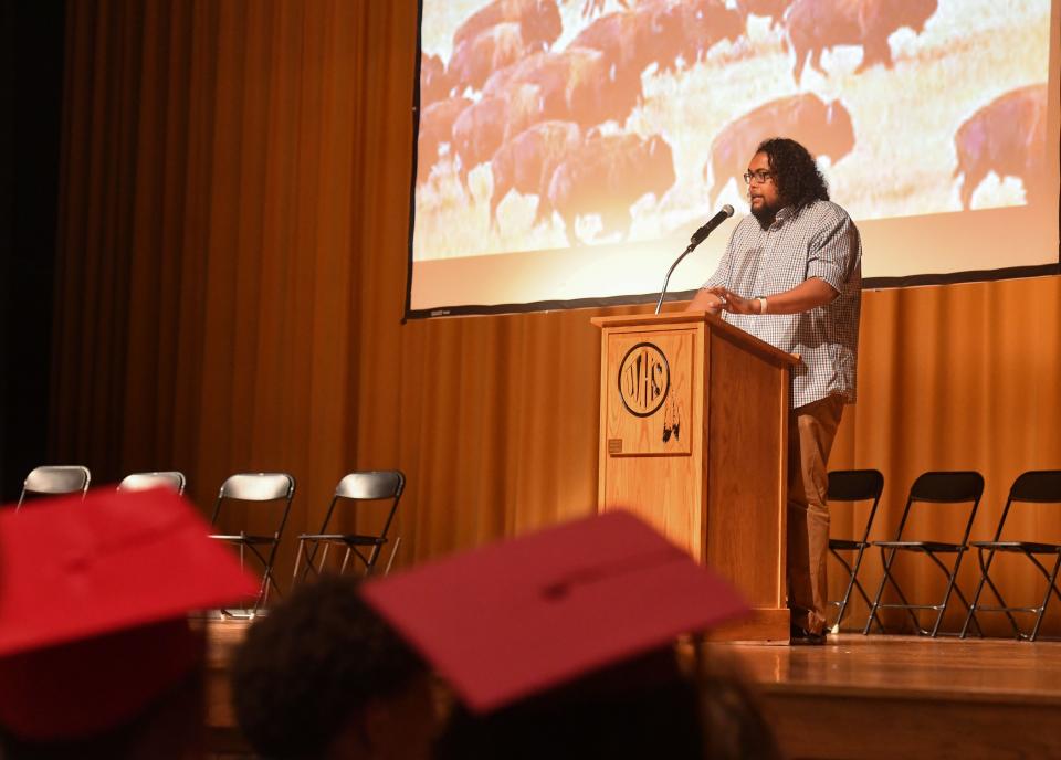 Mason Calhoun, Oceti Sakowin Owaunspe teacher at George McGovern Middle School, speaks at a celebration for graduating Native American students on Friday, May 27, 2022, in Sioux Falls.