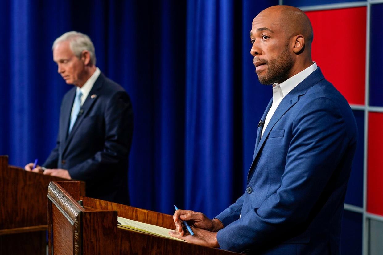 Mandatory Credit: Photo by Morry Gash/AP/Shutterstock (13447422e) Sen. Ron Johnson, R-Wis., left, and his Democratic challenger Mandela Barnes wait for start of a televised debate, in Milwaukee Election 2022 Wisconsin Senate Debate, Milwaukee, United States - 07 Oct 2022