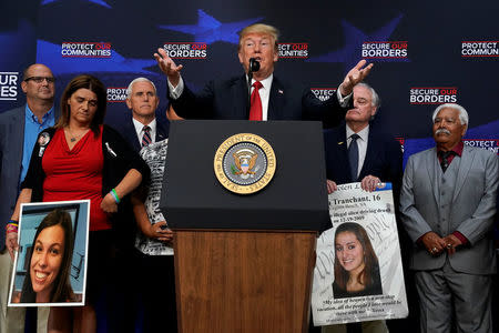 U.S. President Donald Trump speaks during an "Angel Families" meeting with victims of illegal immigration at the White House in Washington, U.S., June 22, 2018. REUTERS/Kevin Lamarque