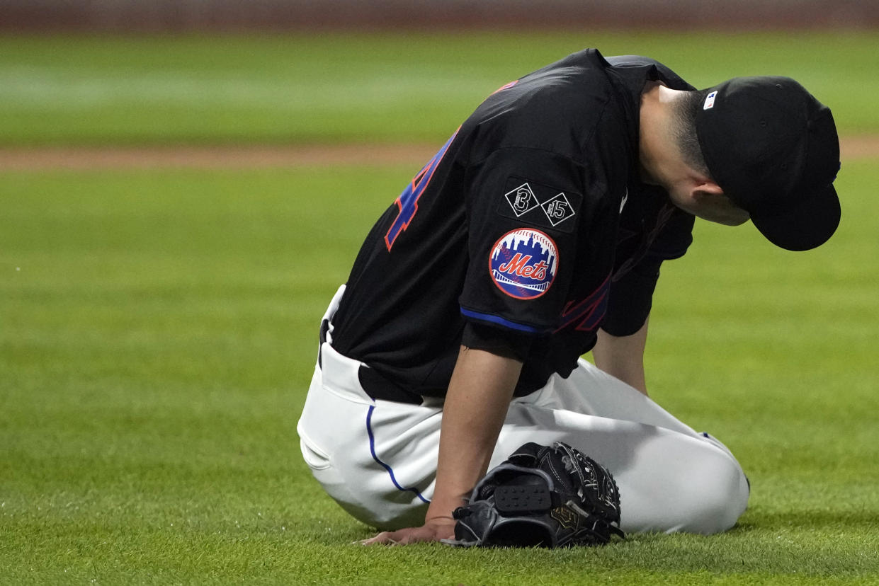 FILE - New York Mets' Kodai Senga reacts after an injury during the sixth inning of a baseball game against the Atlanta Braves, July 26, 2024, in New York. (AP Photo/Pamela Smith, File)