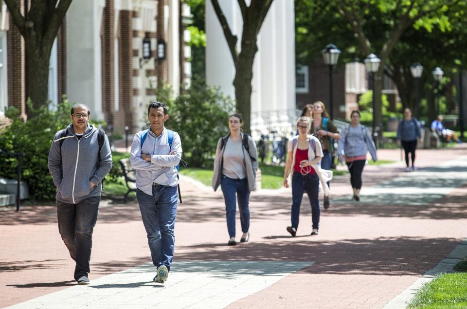 Students walk through the University of Delaware's campus in Newark in this 2016 file photo.