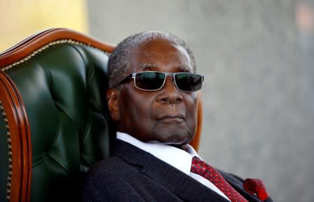 FILE PHOTO: Zimbabwe's former president Robert Mugabe looks on during a press conference at his private residence nicknamed "Blue Roof" in Harare