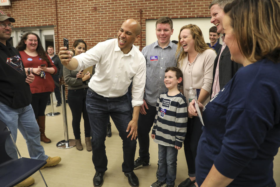 New Jersey Sen. Cory Booker takes selfies with attendees after speaking at a get out the vote event hosted by the NH Young Democrats at the University of New Hampshire in Durham, N.H. Sunday, Oct. 28, 2018. (AP Photo/ Cheryl Senter)