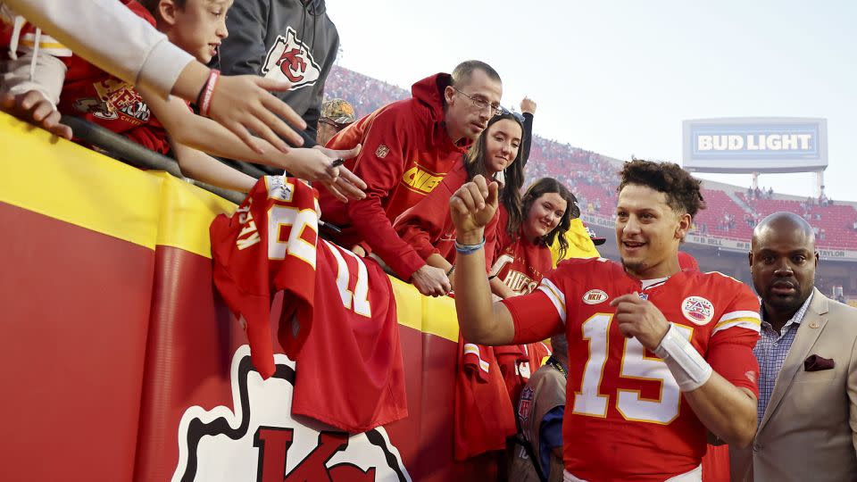 Patrick Mahomes high fives fans as he leaves the field after the game against the Los Angeles Chargers on October 22, 2023. - Jamie Squire/Getty Images