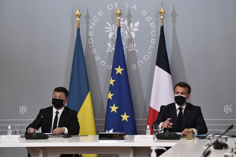 French President Emmanuel Macron and Ukrainian President Volodymyr Zelenskiy hold a news conference following their meeting at the Elysee Palace in Paris