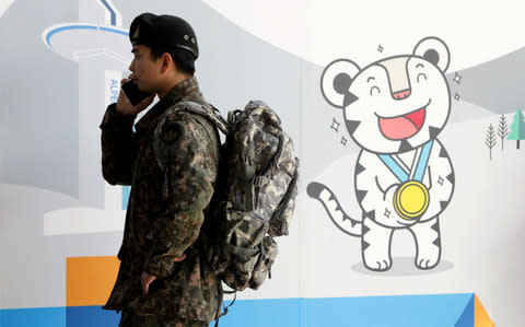 A South Korean soldier uses mobile phone at the 2018 PyeongChang Winter Olympic - Credit: Chung Sung-Jun/Getty Images