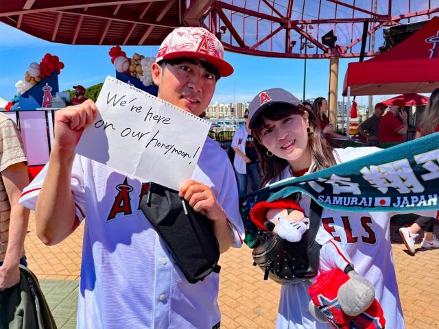 A fan wears a shirt with the face of Los Angeles Angels' Shohei