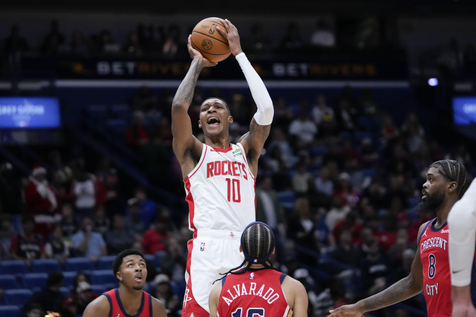 Houston Rockets forward Jabari Smith Jr. (10) shoots over New Orleans Pelicans guard Jose Alvarado (15) in the first half of an NBA basketball game in New Orleans, Saturday, Dec. 23, 2023. (AP Photo/Gerald Herbert)