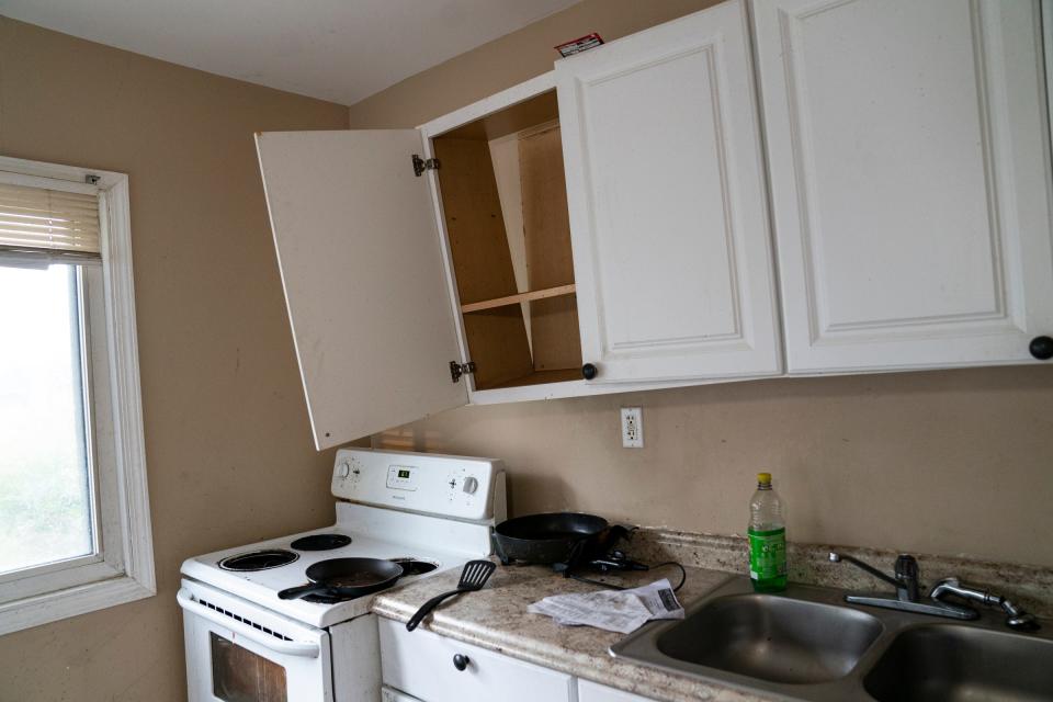 Elisha Maxwell shows the kitchen of the Beechdale Ave. house on Oct. 18, 2022, that she was renting and is now moving from.