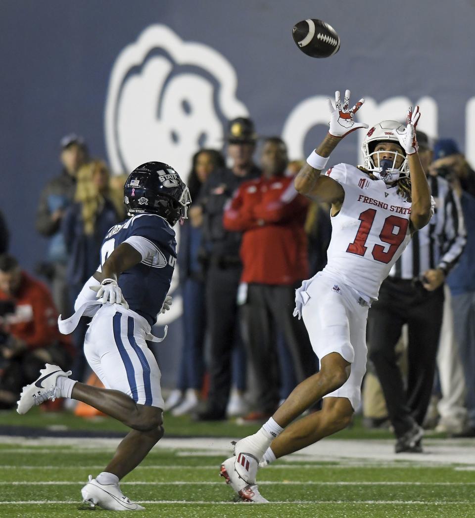 Fresno State wide receiver Josiah Freeman (19) catches a pass as Utah State safety Ike Larsen defends during the second half of an NCAA college football game Friday, Oct. 13, 2023, in Logan, Utah. | Eli Lucero/The Herald Journal via AP