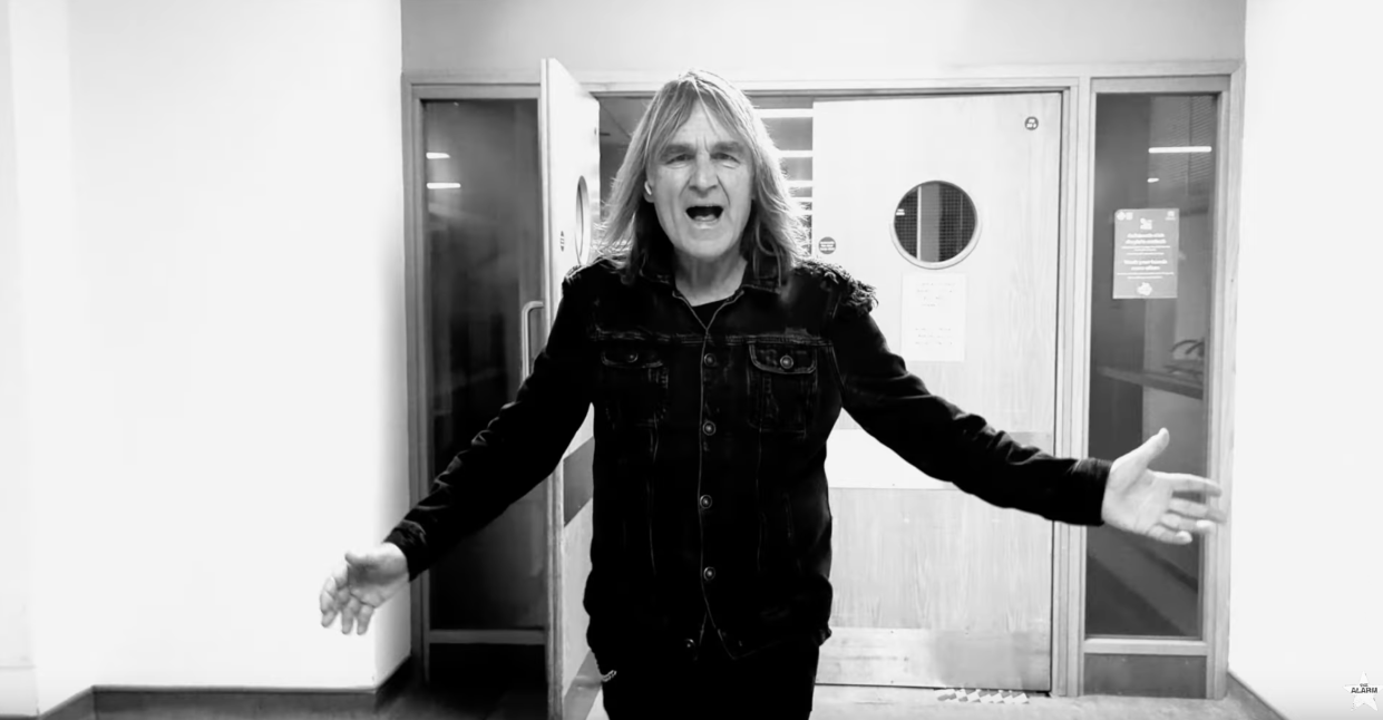 Mike Peters walks the corridors of North Wales Cancer Centre in the video for 