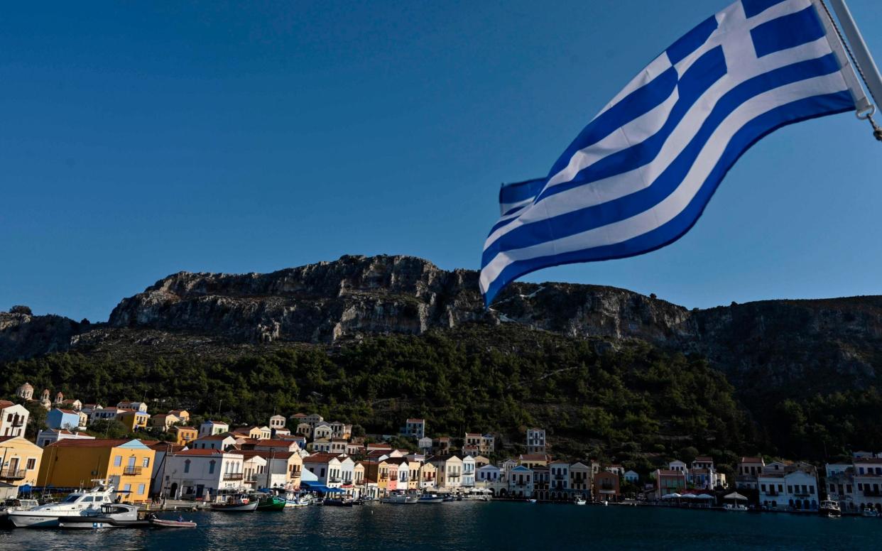 The Greek island of Kastellorizo lies about a mile off the Turkish coast - AFP