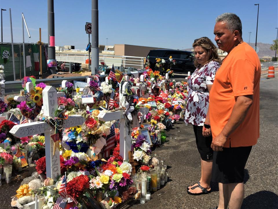 Grace Bueno and Albert Artalejo, both of Granbury, Texas, visit the El Paso Walmart shooting memorial on Sunday,  Sept. 1, 2019.