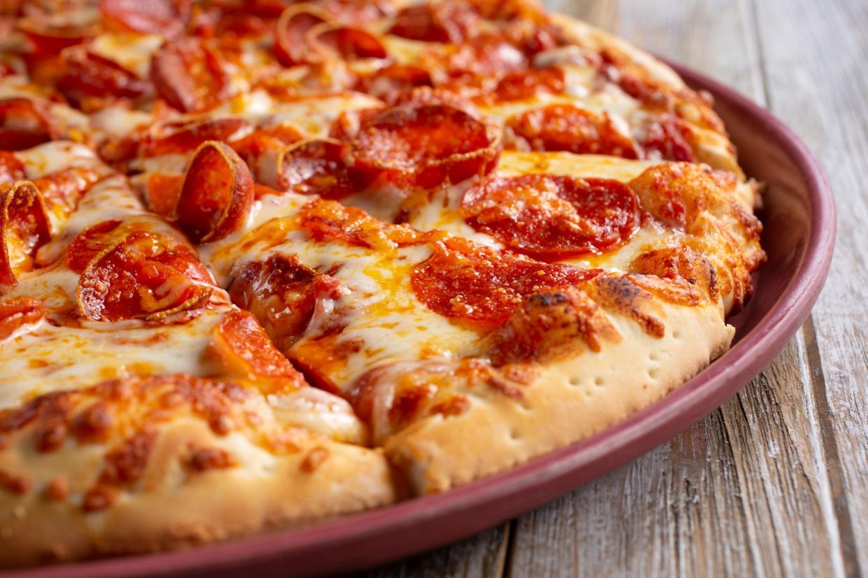 A view of a pepperoni pizza pie.