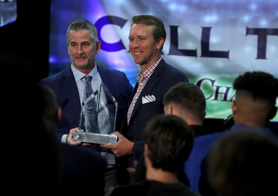 Colts head coach Frank Reich, left, presents the Call to Courage Award to NFL quarterback Nick Foles, right, at the Hyatt Regency Buffalo on Saturday, May 7, 2022.