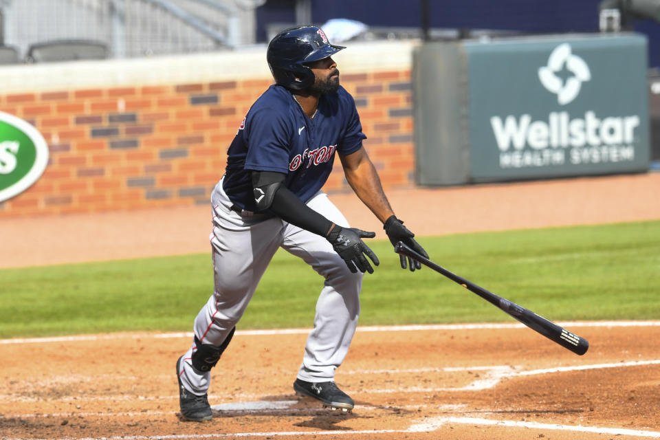 Boston Red Sox' Jackie Bradley Jr. watches his line drive soar to center field for a home run against the Atlanta Braves during the fourth inning of a baseball game Sunday, Sept. 27, 2020, in Atlanta. (AP Photo/John Amis)