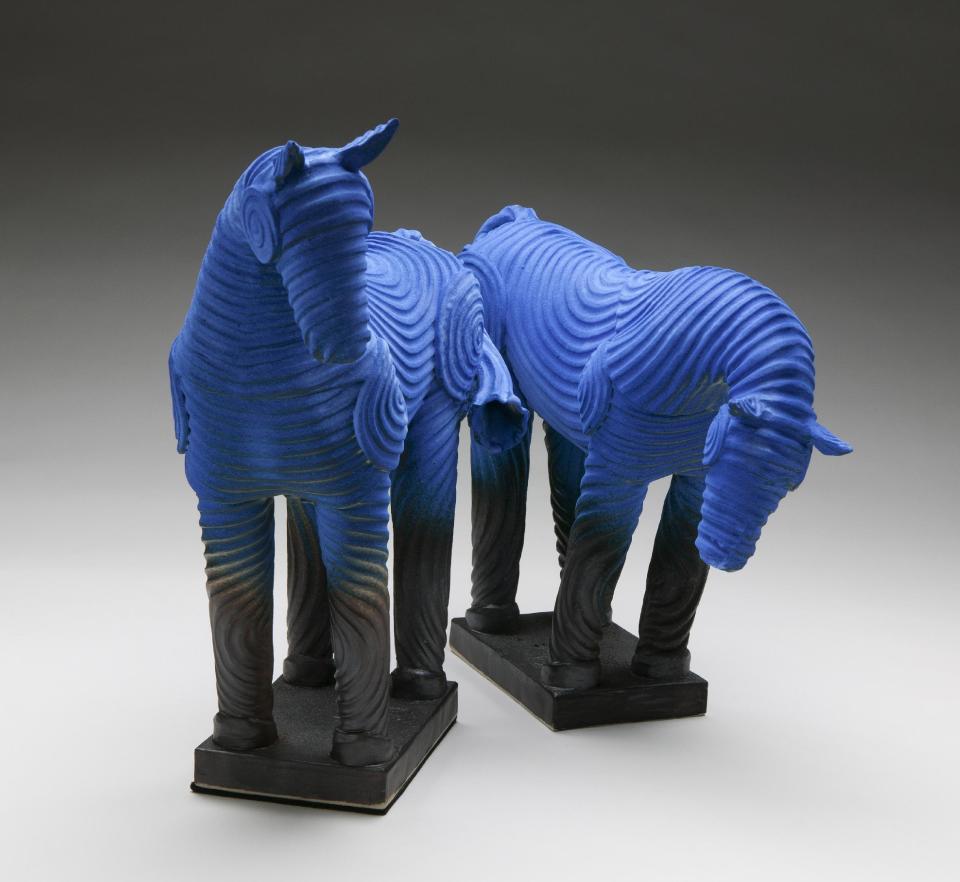 This undated publicity photo provided by Bill Sanders shows blue ceramic horses. Sanders, who worked in lumber and wood flooring for 20 years, honed the ceramic skills he learned as a teenager growing up in the Philippines after selling his business in the late 1990s. Now living in Steamboat Springs, Colo., with his artist wife, Barbara, Sanders, 64, creates ceramic sculptures, such as the horses featured here. (AP Photo/Bill Sanders, Tim Murphy)