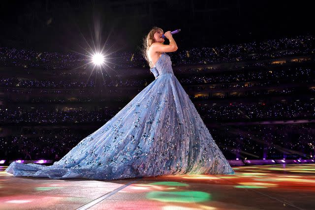 <p>Kevin Winter/TAS23/Getty</p> Taylor Swift in blue on The Eras Tour in L.A.