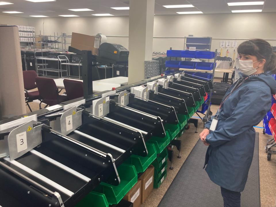 A Shasta County elections workers sorts ballots Tuesday, Feb. 1, 2022 after polls closed in the District 2 supervisor recall election.