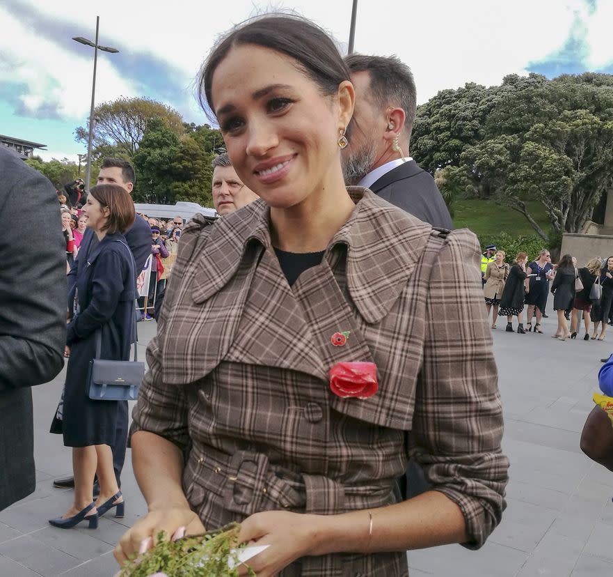 The Duchess of Sussex chats with a member of the crowd at the Wellington War Memorial in New Zealand.