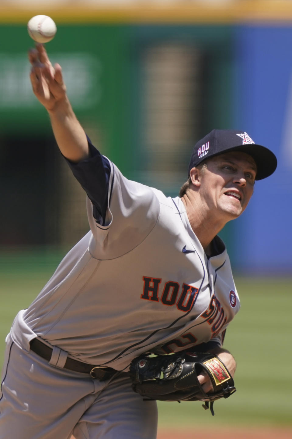 Houston Astros starting pitcher Zack Greinke delivers in the first inning of a baseball game against the Cleveland Indians, Sunday, July 4, 2021, in Cleveland. (AP Photo/Tony Dejak)