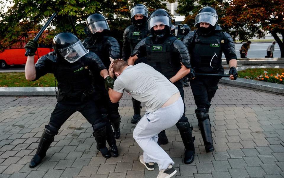 Police officers detain demonstrators during a protest the day after the presidential election, in Minsk, Belarus - YAUHEN YERCHAK/EPA-EFE/Shutterstock
