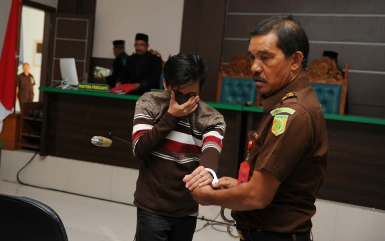 A sharia court sentenced two men to be publicly caned for gay sex for the first time in Indonesia's conservative province of Aceh, the latest sign of a backlash against homosexuals in the Muslim-majority country