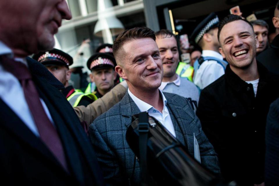 Tommy Robinson being greeted by supporters after a contempt hearing was adjourned at the Old Bailey on 27 September (Getty)