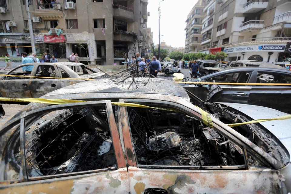 A car damaged as a result of a car bomb attack on the convoy of Egyptian public prosecutor Hisham Barakat near his house at Heliopolis district, is seen in Cairo