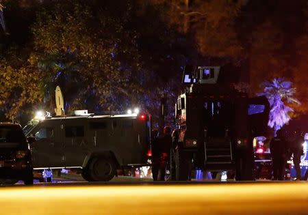 Police vehicles line the street outside the house of one of the suspects in a mass shooting in San Bernardino, California December 2, 2015. REUTERS/Mario Anzuoni