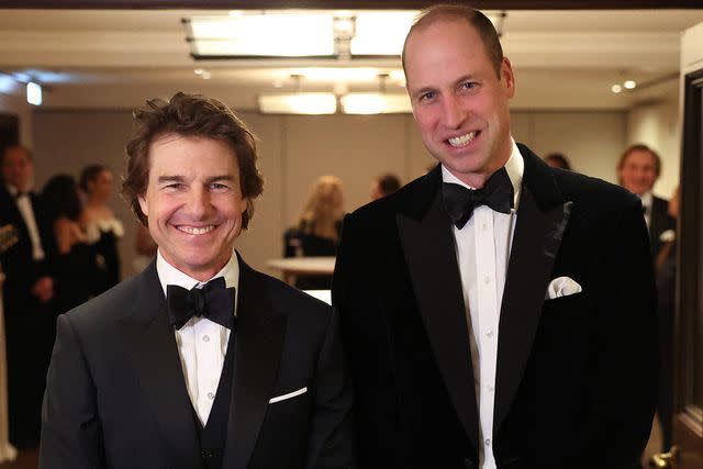 <p>DANIEL LEAL/POOL/AFP via Getty</p> Tom Cruise and Prince William attend London Air Ambulance Charity Gala on Feb. 7, 2024