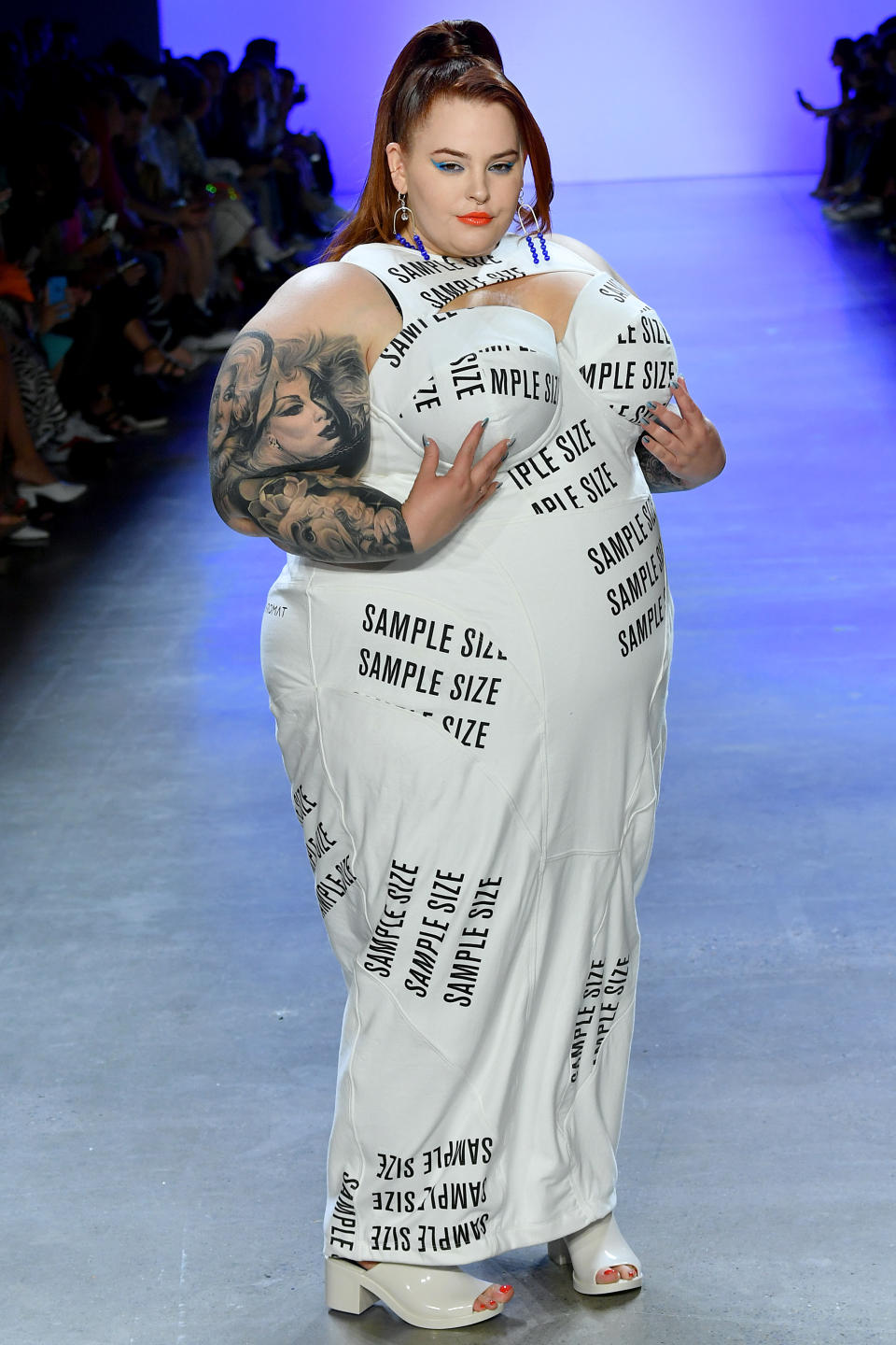 Tess Holliday walks the runway for Chromat Spring/Summer 2020 in a white corset dress. [Photo: Getty]