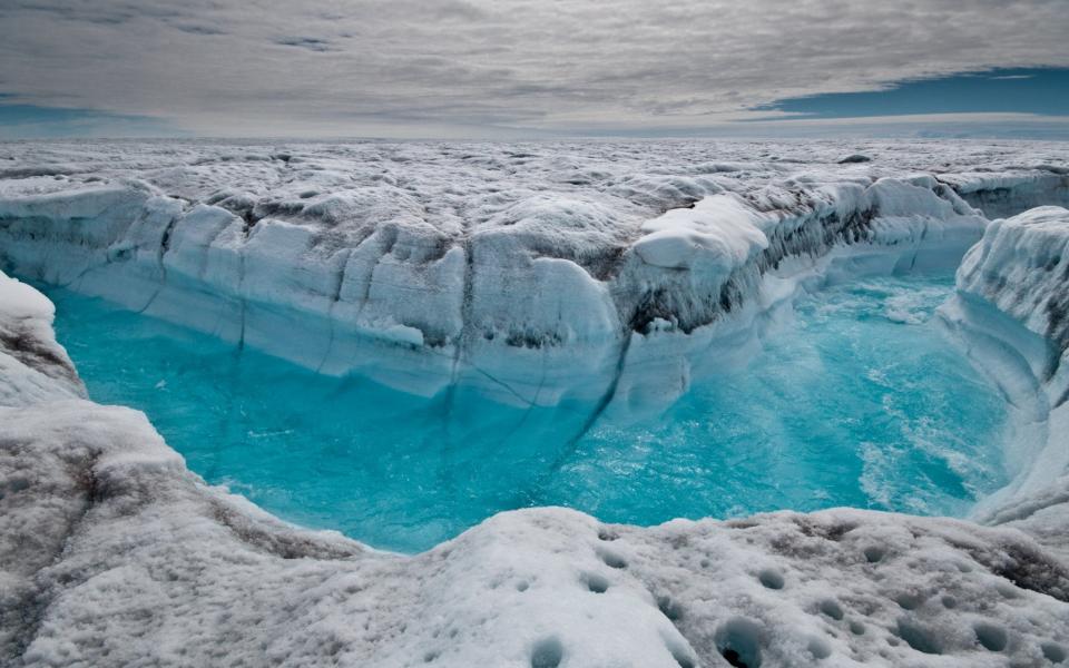 Surface melt water rushing along the surface of the Greenland Ice Sheet - Ian Joughin  /AP