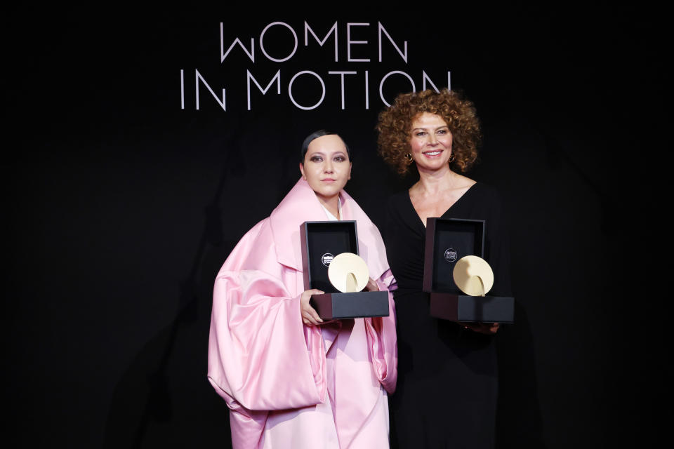 Amanda Nell Eu (left) and Donna Langley pose with Women in Motion 2024 Award during the Kering And Cannes Film Festival Official Dinner on May 19, 2024 in Cannes, France.