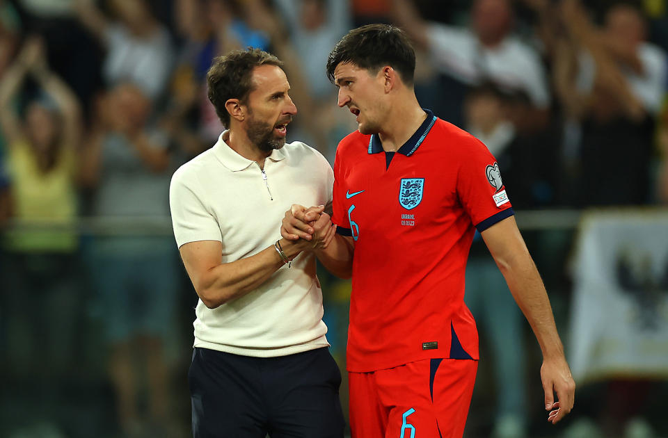 England head coach Gareth Southgate (left) with Harry Maguire after their 1-1 Euro 2024 qualifying draw with Ukraine in Poland.
