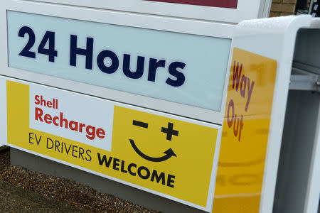 Signs are seen at the Holloway Road Shell station where Shell is launching its first fast electric vehicle charging station in London, Britain October 18, 2017. REUTERS/Mary Turner