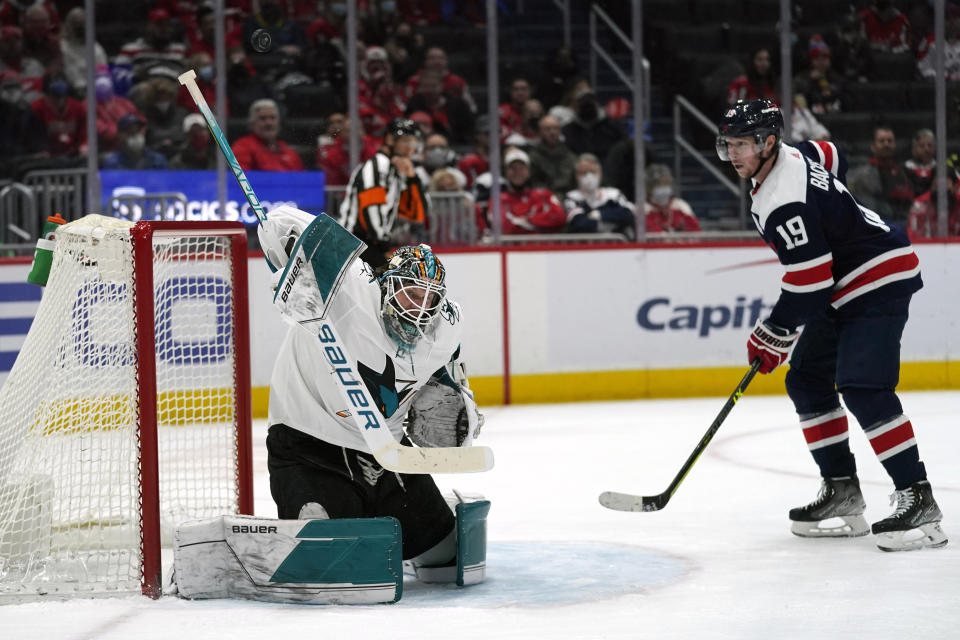 San Jose Sharks goaltender James Reimer (47) blocks a shot by Washington Capitals center Nicklas Backstrom (19) during the third period of an NHL hockey game, Wednesday, Jan. 26, 2022, in Washington. The Sharks defeated the Capitals 4-1. (AP Photo/Evan Vucci)