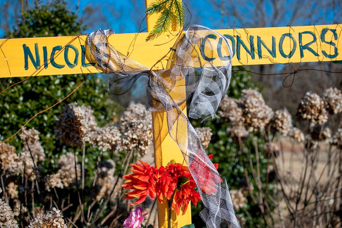 A cross memorializes Nicole Connors, a victim of the mass shooting, at the entrance to the Hedingham neighborhood on Friday, January 13, 2023 in Raleigh, N.C.