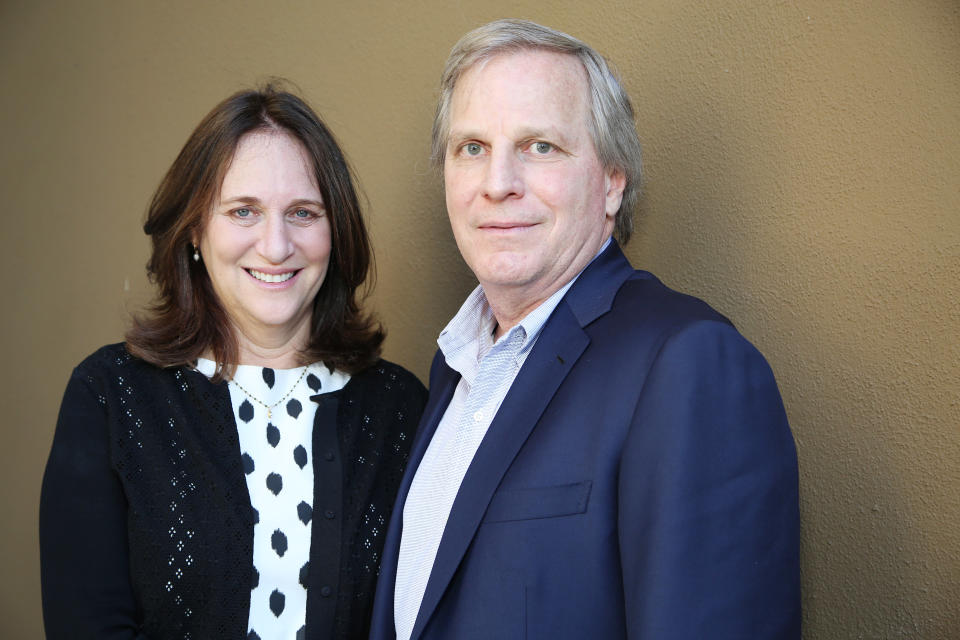 In this Saturday, March 8, 2014 photo, Lucy Fisher, left, and Doug Wick, producers of the film "Divergent," pose for a portrait in Beverly Hills, Calif. For Fisher and Wick finding a studio to invest in the adaptation of Veronica Roth’s young adult novel “Divergent” meant braving a number of rejections before securing a deal with Summit Entertainment. Drawing comparisons to “The Hunger Games,” “Divergent,” out Friday, March 21, 2014, is the next YA blockbuster hopeful. (Photo by Annie I. Bang /Invision/AP)