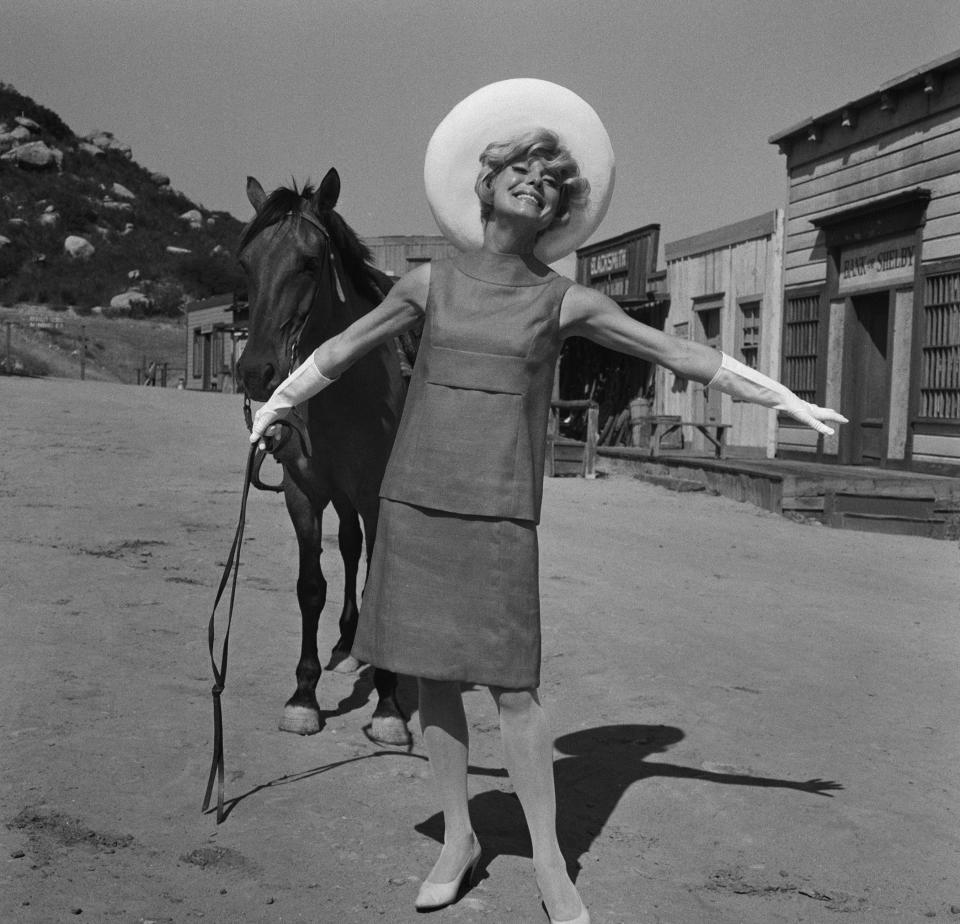 Channing holds the reins of a horse on an Old West set during the shooting of her Emmy-winning television special "An Evening With Carol Channing," Aug. 12.&nbsp;