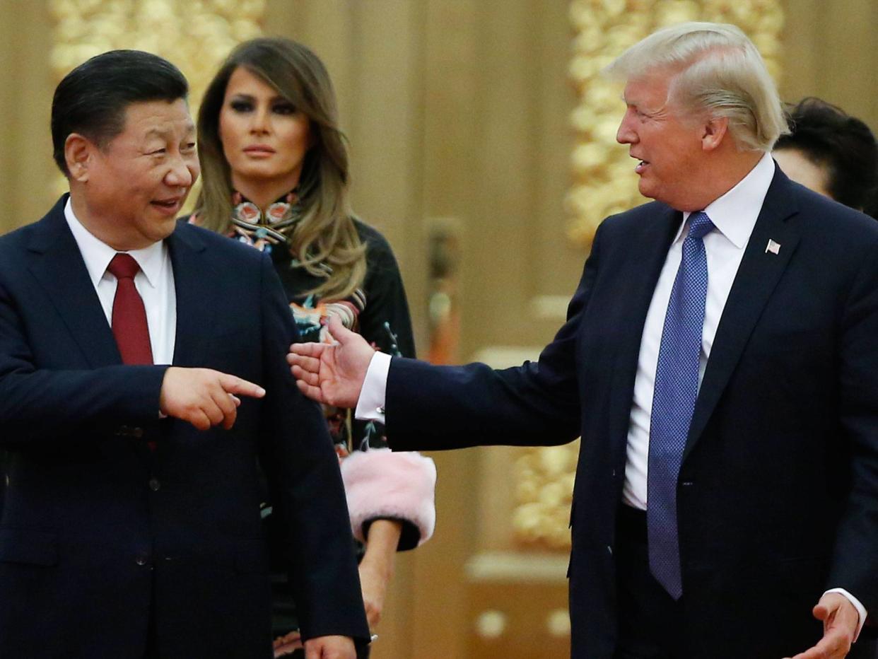 Donald Trump and Xi Jinping arrive at a state dinner at the Great Hall of the People in Beijing: EPA