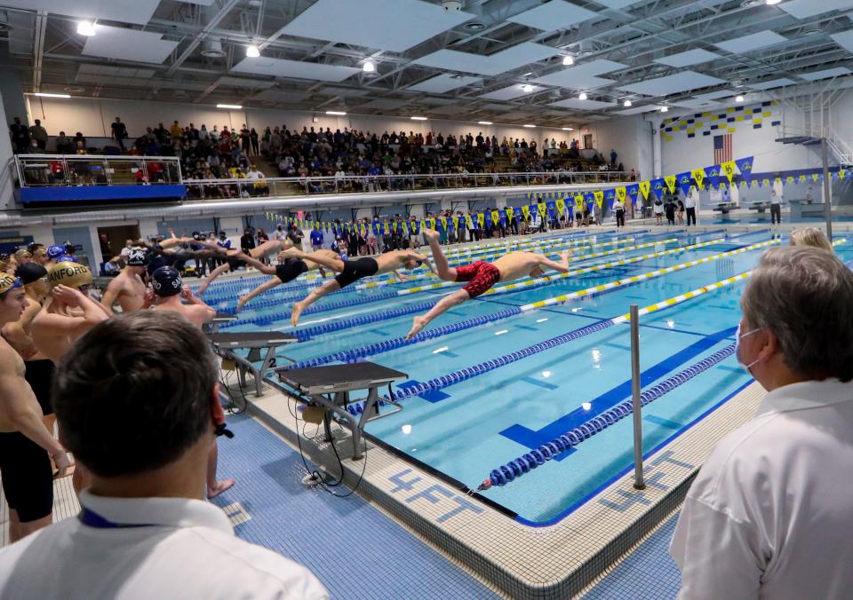 The field starts in the final of the 400 yard freestyle relay during the DIAA swimming championships at the Rawstrom Natatorium at the University of Delaware, Saturday, Feb. 26, 2022.