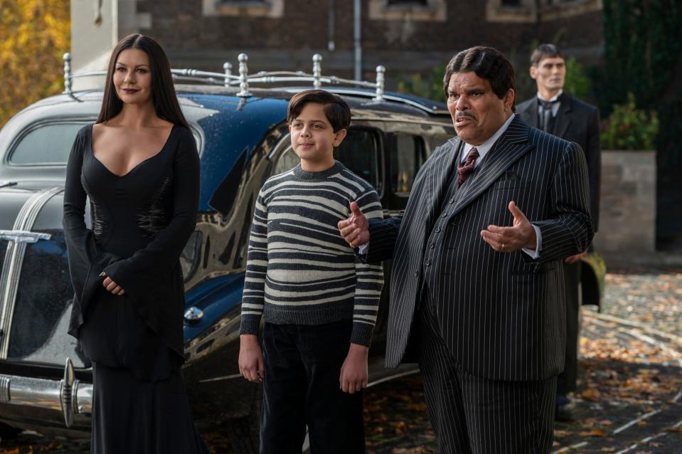 Addams family regulars – Morticia (Catherine Zeta-Jones, far left), Pugsley (Issac Ordonez), Gomez (Luis Guzmán) and Lurch (George Burcea) – have supporting roles in "Wednesday."