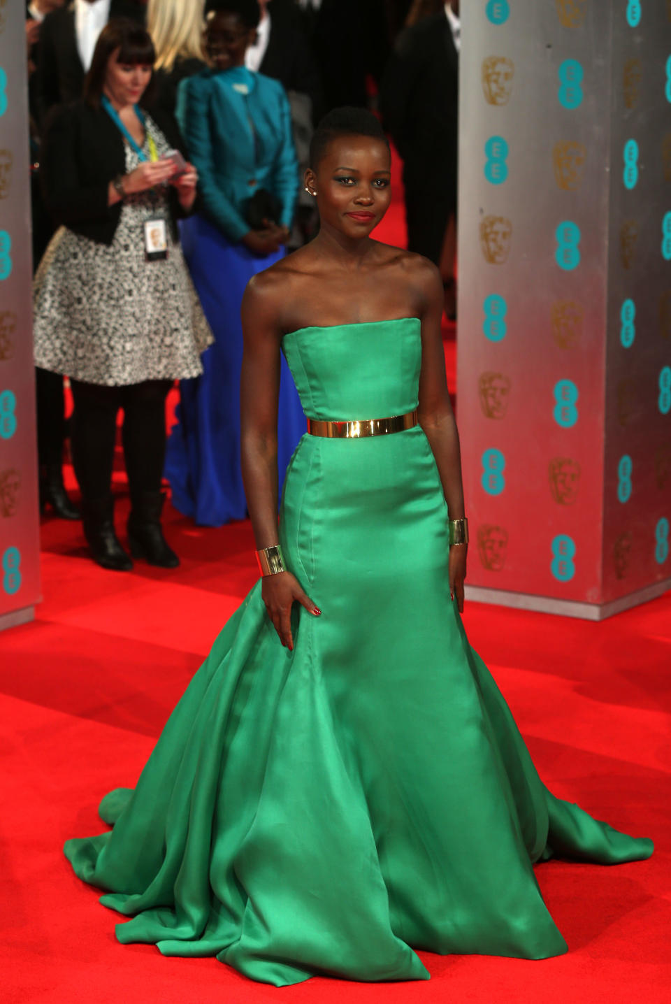 Actor Lupita Nyong'o poses for photographers on the red carpet at the EE British Academy Film Awards held at the Royal Opera House on Sunday Feb. 16, 2014, in London. (Photo by Joel Ryan/Invision/AP)
