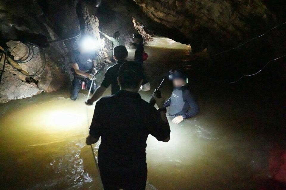 Rescuers had to navigate murky waters and dangerous passageways (Thai Navy SEAL via Getty Images)