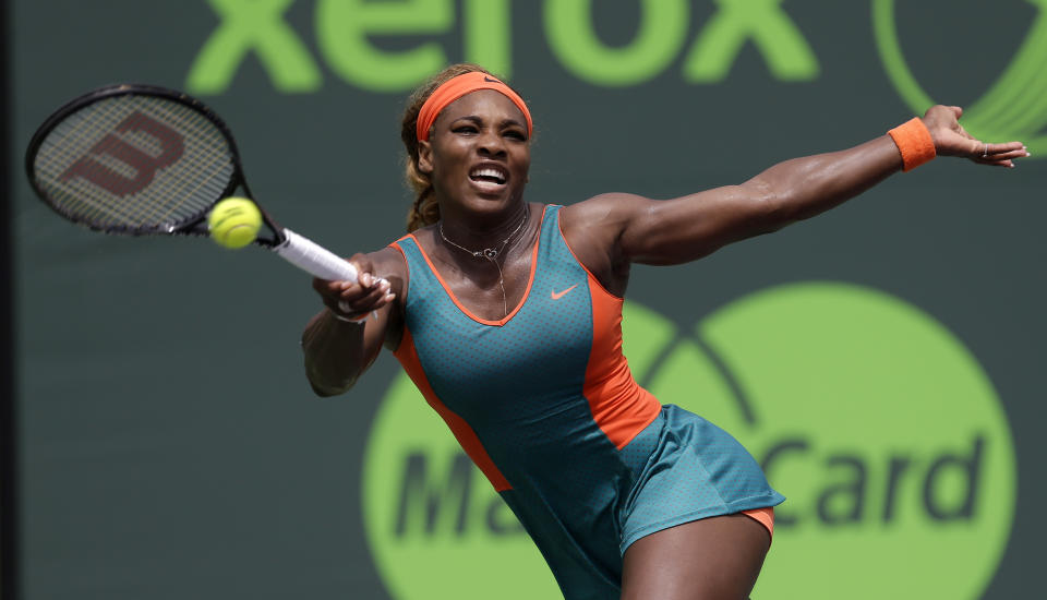 Serena Williams, of the United States, returns to Caroline Garcia, of France, at the Sony Open tennis tournament in Key Biscayne, Fla., Saturday, March 22, 2014. (AP Photo/Alan Diaz)