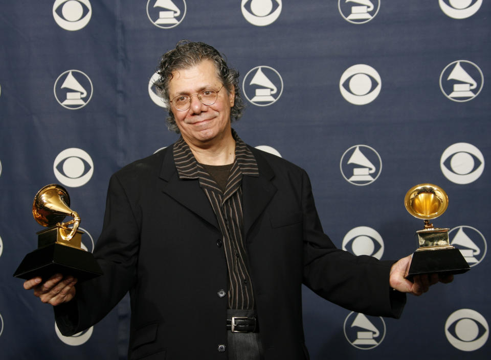 FILE - Chick Corea is photographed with his awards at the 49th Annual Grammy Awards on Feb. 11, 2007, in Los Angeles. He won from best jazz instrumental and best instrumental arrangement. Corea, a towering jazz pianist with a staggering 23 Grammy awards who pushed the boundaries of the genre and worked alongside Miles Davis and Herbie Hancock, has died. He was 79. Corea died Tuesday, Feb. 9, 2021, of a rare for of cancer, his team posted on his web site. His death was confirmed by Corea's web and marketing manager, Dan Muse. (AP Photo/Kevork Djansezian, File)