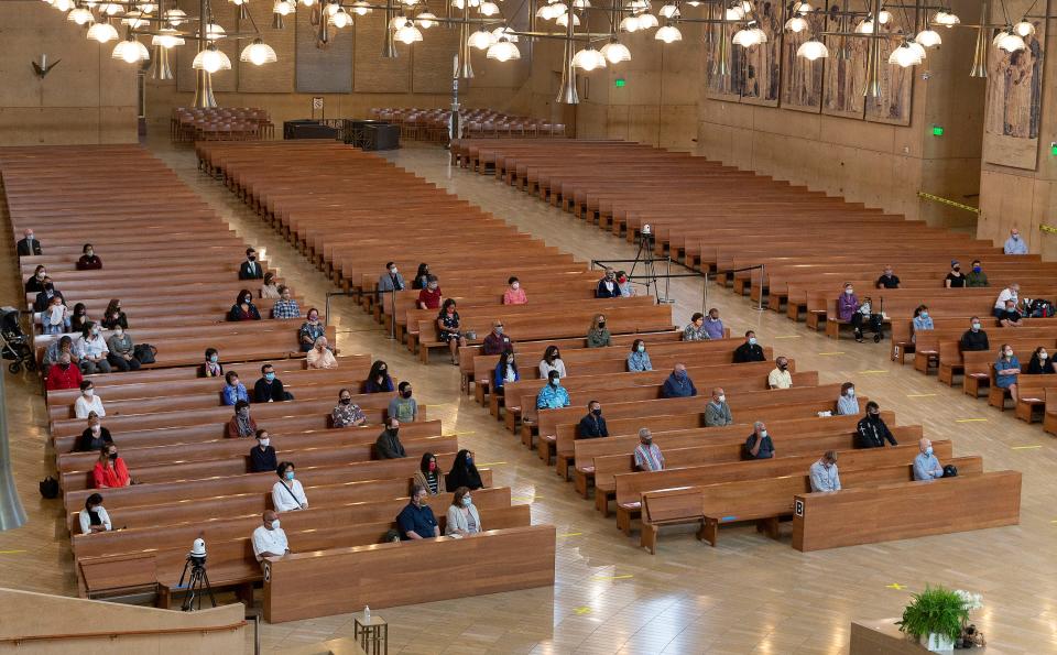 About 100 people gather in July for Mass at the Cathedral of Our Lady of the Angels in Los Angeles for its first in-person service in months.